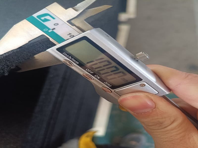 Technician testing concrete moisture levels before flooring installation